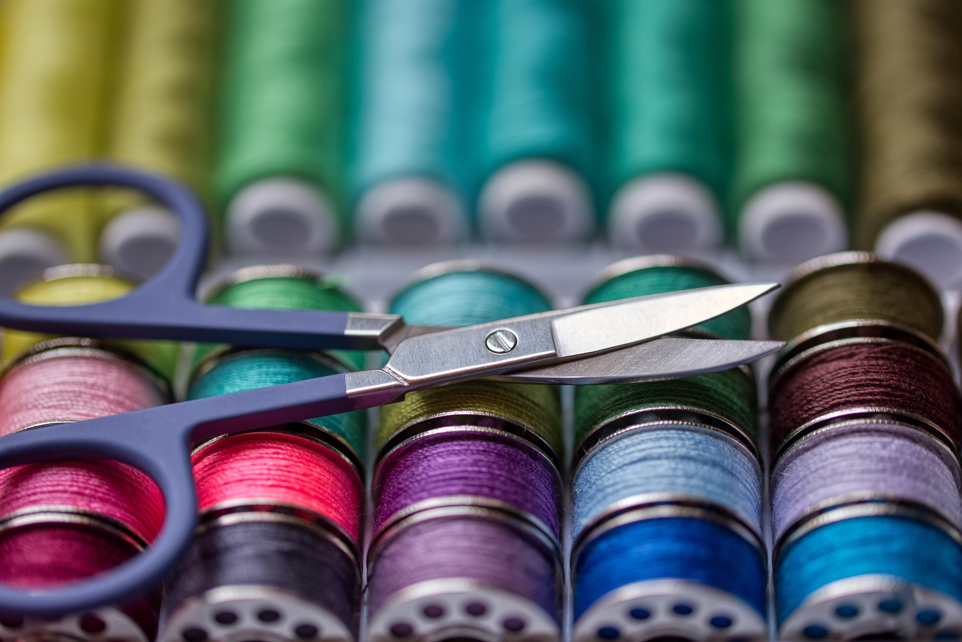 Colourful sewing threads and scissors