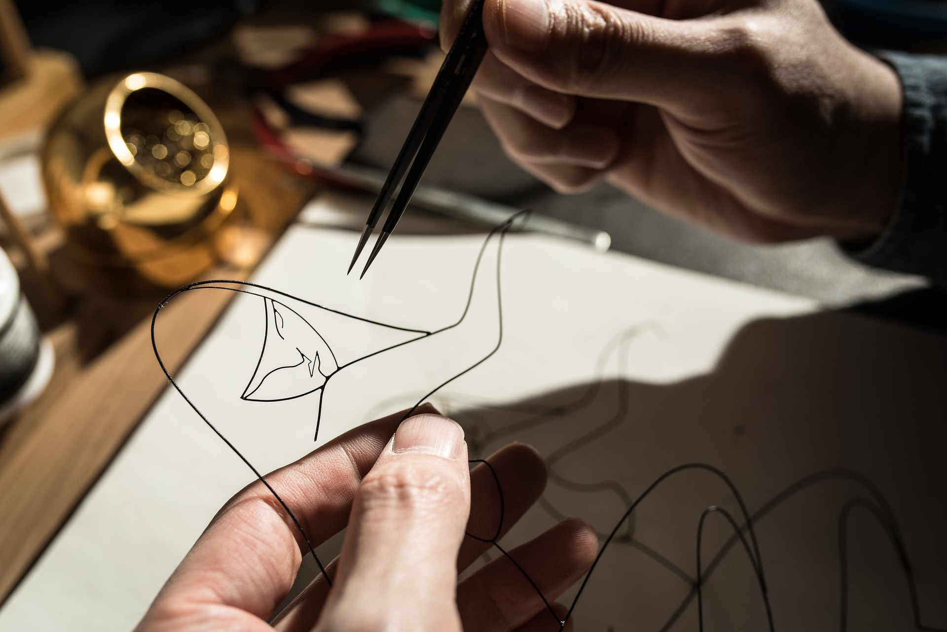 Wire sculpture being formed by hand