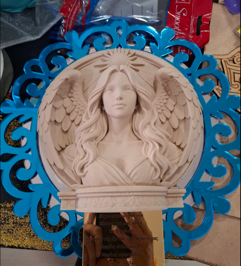 Handmade angel relief plaque in a blue laser-cut frame